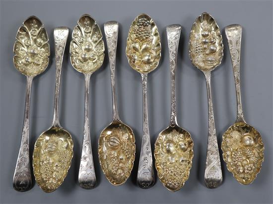 Eight assorted George III silver Old English pattern berry spoons, various dates and makers, 16 oz.